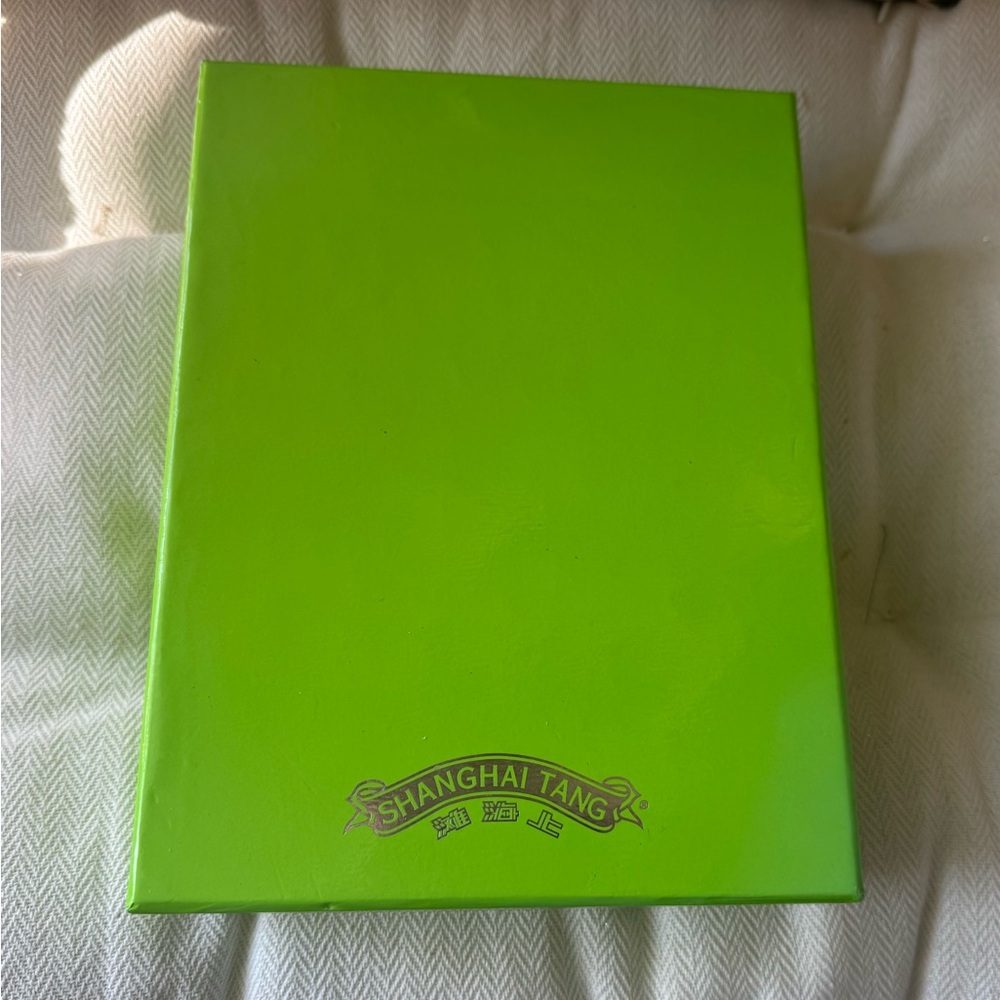 Shanghai Tang bold green gift box with fabulous purple interior.